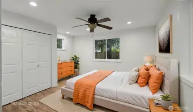 Secondary bedroom with handy nook for dresser, desk, or toys. Virtually staged.