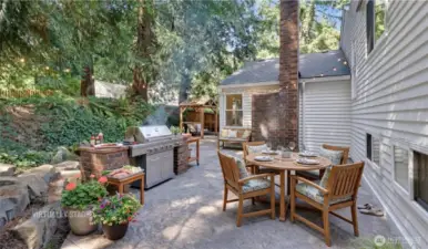 Virtually staged patio including bbq area and brick accents