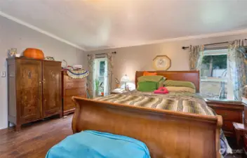 Primary Bedroom with bamboo flooring.