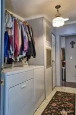 Utility Room and furnace and tile flooring.