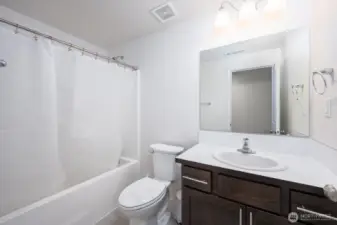 Large Full Shared Bath w/ ceramic tile.