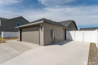 Huge extension to Driveway with Man-Door access to garage.