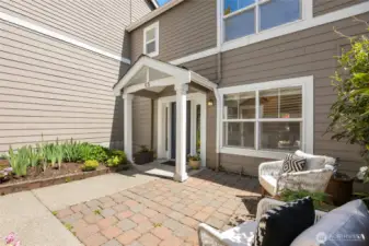 The entry has a charming patio...