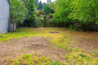Huge side yard is fully fenced with large drive through gate. So much space to enjoy with tons of privacy!