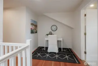 Upstairs landing makes a perfect spot for a reading nook.