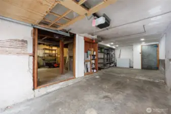 Extra long garage with huge attached workshop.