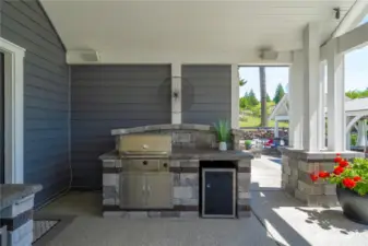 Two BBQ's - one is gas, one is charcoal.