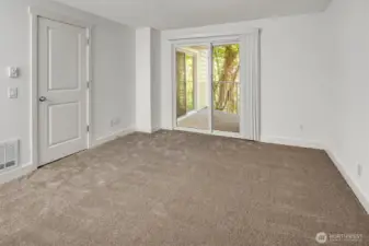 Primary bedroom offers balcony access