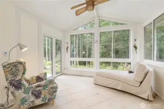 Relax in the sunroom and take in the view of your gorgeous property or step out onto the entertainment-sized deck. Radiant heated tile floor allows enjoyment of this space year-round!