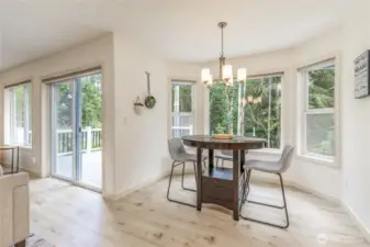 Thoughtful windows across the back of the house provide gorgeous views from all the main living areas. Concealed Hunter Douglas shades provide sun protection when needed.