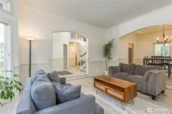 Living room just off the entry. Hybrid heating (furnace and heat pump) provide year-round comfort.
