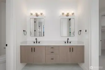 I love the way these cabinets float. Designer hardware, fixtures and quartz countertops!