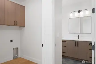 Upstairs laundry located near bathroom