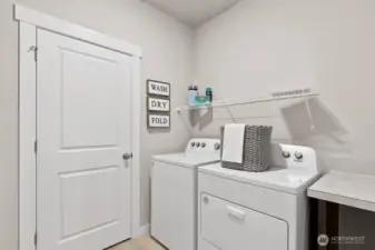 Utility room. Photo rendering is representational. Actual home is under construction and finishes, elevation, and paint colors may vary. See site agent for details.