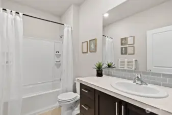 Hallbath. Photo rendering is representational. Actual home is under construction and finishes, elevation, and paint colors may vary. See site agent for details.