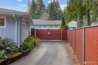 Backyard features an automated fencing gate, providing effortless, remote-controlled entry for vehicles, pets, and added privacy