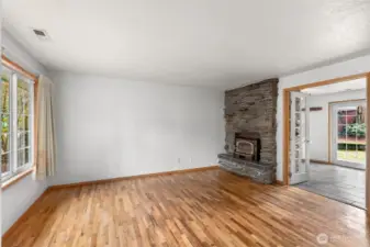 Features a charming wood-burning fireplace, offering rustic elegance and a cozy centerpiece for entertaining and unwinding