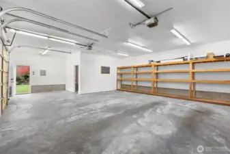 Garage equipped with water hookup capabilities, ideal for workshop use, pet washing, gardening and easy cleanup