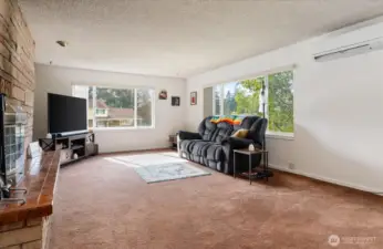 Here's the family room, which mirrors the living room in dimenstons, and has it's own fireplace.