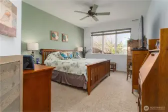 Main bedroom with large rear window to backyard