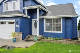 A welcoming path invites you to step inside and enjoy the views beyond.