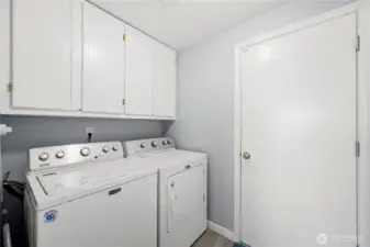 Main-level laundry room conveniently located near the garage.