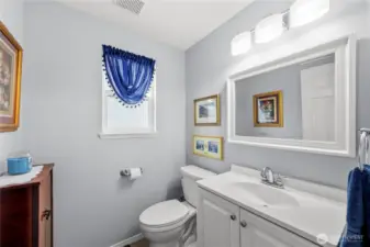 Main floor powder room perfect for guests.