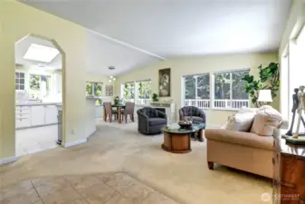Bright living room/dining room greet you as you enter. Vaulted ceilings add drama.