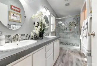 Remodeled primary ensuite with separate water closet, linen closet around the right corner