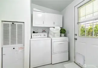 Laundry room with doggy door. Leads to side yard.