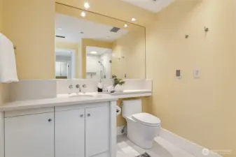 Shared bath with remodeled shower.