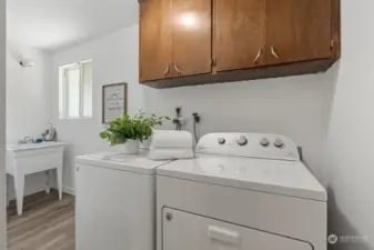 Laundry room with extra storage and 1/2 bath