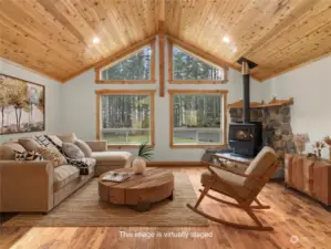 Virtually staged image: vaulted ceiling , big windows