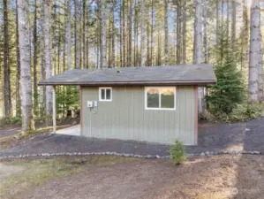 Well Pump house - includes a 2nd propane tank and a studio-style  living space with 3/4 bath , kitchenette, sink, bed, etc.