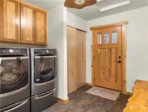 Feat. washer/dryer, custom everything - door, light fixture, bench , cabinet.