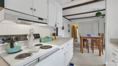 Another view of the kitchen peering into the dining area.