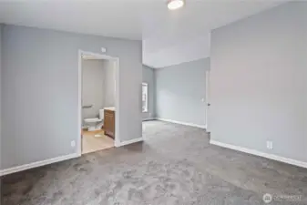 Main bedroom looking toward bathroom on the left and sitting area straight ahead