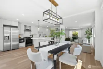 The elegant dining room opens to both the kitchen and the covered outdoor deck, making entertaining effortless.