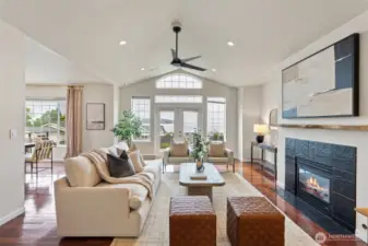 Walk straight and you'll immediately find brazilian cherry hardwoods leading to the expansive living room