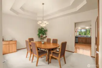 Formal dining room with coffered ceiling.