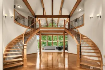An impressive foyer with double staircase and soaring ceilings welcomes you home.