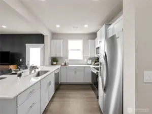 Long prep counter with undermount sink keeps the chef connected to guests across the open concept layout. Pictures are for representational purposes only, colors and features may vary.