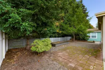 Large raised garden bed and established patio