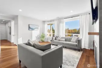 From living room down hallway to entrance, office, powder room, primary suite and laundry