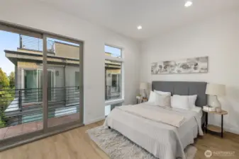 Primary suite with private balcony access — Wake up and step directly onto your balcony. Airy ceilings and soft natural light complete this peaceful retreat.