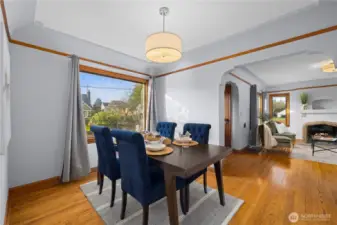 Formal dining room connects the living room to the kitchen.