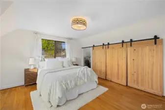 #2 bedroom. Barn doors cover washer and dryer... a simple delight for same level living.