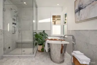 Primary Bedroom on this level is a spacious retreat with all the amenities needed for a relaxing and rejuvenating atmosphere.  Make life simple with lighted closet organizers. In-spa bath with glass enclosed steam shower, free standing bathtub, heated floors and towel rack, dual sinks and plenty of cabinet space. High quality Kohler fixtures, mosaic marble, pewter sconces, hand rubbed antique brass, dual Robern medicine cabinets.