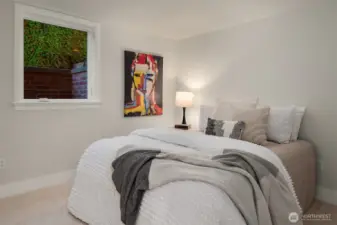 Additional bedroom on lower level provides versatile space for a home office, gym, or live-in nanny quarters.