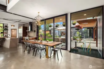 Expansive dining room with pendant chandelier and patio access
